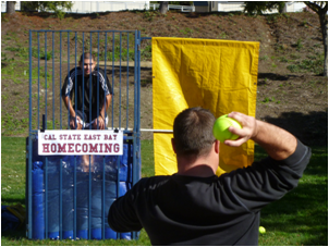 Mario Castellanos, assistant golf coach, gets dunked for Make-A-Wish.